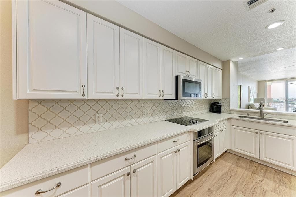 610 RIVIERA DUNES WAY 404 photo 19